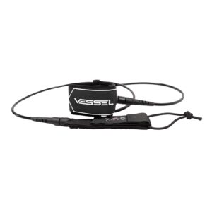 This image shows a slightly angled side - view of the black Vessel ankle leash. The features such as the coiled design, Velcro strap, and the brand name "VESSEL" are clearly visible, similar to the first picture.