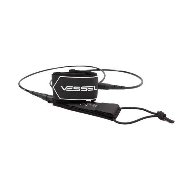 This image shows a slightly angled side - view of the black Vessel ankle leash. The features such as the coiled design, Velcro strap, and the brand name "VESSEL" are clearly visible, similar to the first picture.