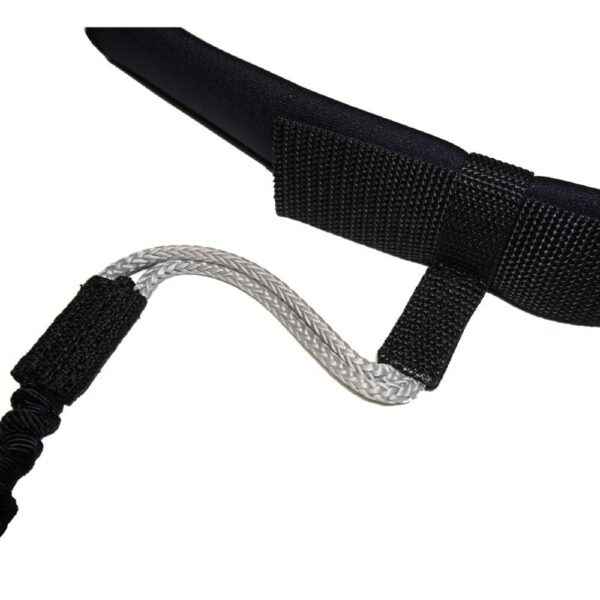 attachment of the coiled rope to the black strap, highlighting the secure and robust connection mechanism.