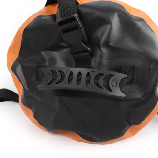 A detailed view of the strap on the Outdoor Luxury waterproof duffle bag, showcasing the sturdy, perforated design for enhanced comfort and strength.