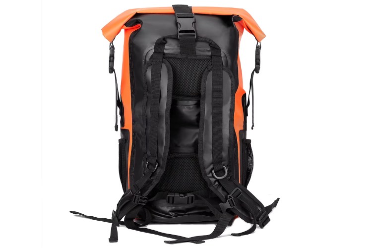The image shows the back view of a backpack with a bright orange front and black straps and back panel. It features multiple compartments and adjustable straps.