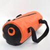 A side view of the Outdoor Luxury waterproof duffle bag, emphasizing its cylindrical shape, durable material, and the position of the handles and strap.