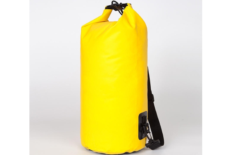 The image depicts a bright yellow waterproof dry bag with a roll - top closure and a shoulder strap. It is designed to keep contents dry in wet environments.