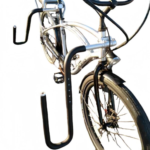 Silver beach cruiser bike with black adjustable surfboard rack arms mounted on frame