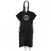 Black surf poncho with white Trigger Bros logo on chest, displayed on mannequin