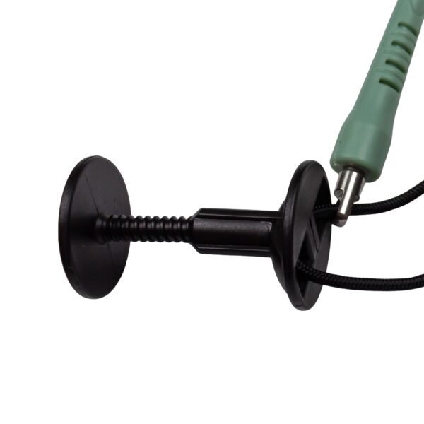 Close-up of glossy coiled TPU cord on grey green bodyboard leash