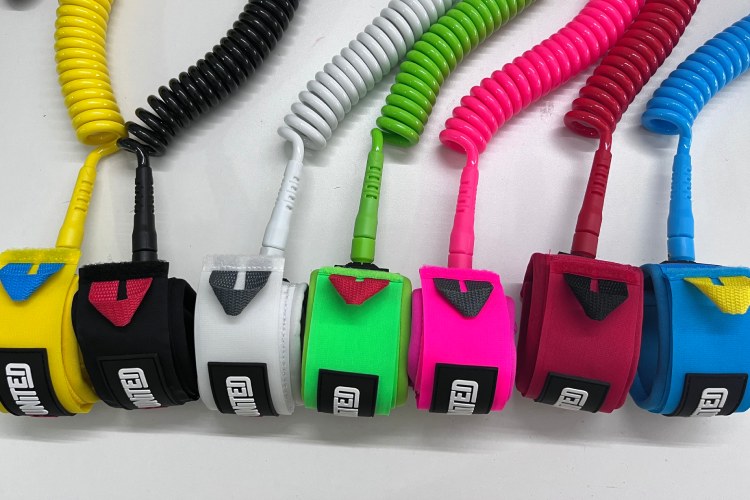 Multiple colored SUP leash cuffs with matching coiled cords