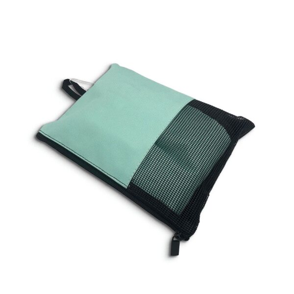 Folded surf changing mat in mesh pouch with zipper and carry handle