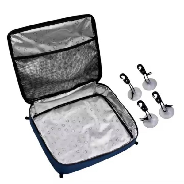 The inside of the bag, revealing a shiny, silver - lined interior with a mesh pocket on the lid and four suction cups placed next to the bag