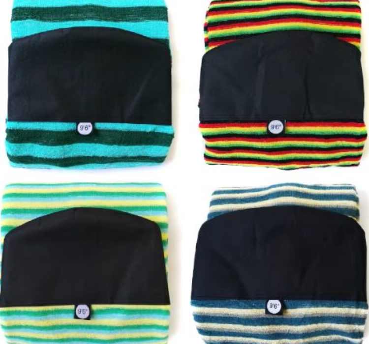 The image features surfboard socks with black triangular inserts and colorful striped patterns. Each sock has a "9'6"" label.