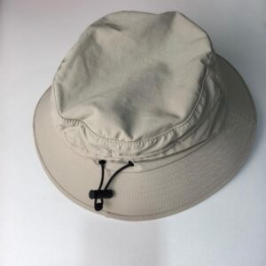 Surf Fishing Hat (Top View) This image shows the surf fishing hat from a top - down perspective. The hat is light beige with a wide brim, and it has a black adjustable strap visible on the inside.