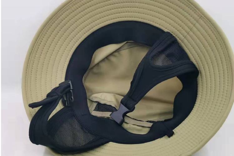 The inside of the olive green surf hat shows a black inner band with mesh material, likely for comfort and breathability.