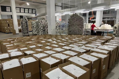 Shero Surf production team preparing packaged surf gear for shipment