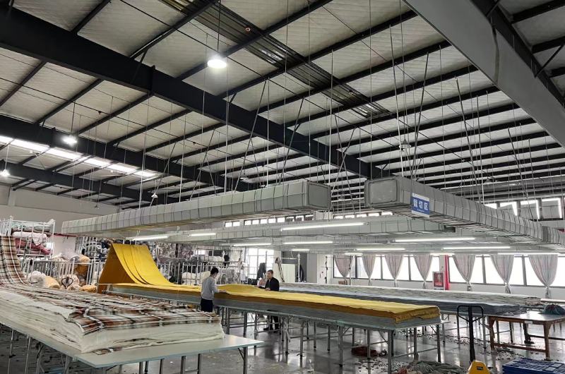 Spacious and organized cutting area at Shero Surf workshop ensuring consistent production quality